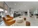 Bright lounge area boasts a marble floor, bar, seating, and floor-to-ceiling windows at 151 E Washington St # 5B, Orlando, FL 32801