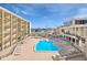Exterior showcases a swimming pool and outdoor lounge area for relaxation at 151 E Washington St # 5B, Orlando, FL 32801