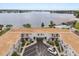 Aerial view of property and community amenities, nestled alongside a serene lake at 151 N Orlando Ave # 212, Winter Park, FL 32789