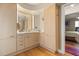 Bright bathroom with ample cabinet space and bamboo floors at 151 N Orlando Ave # 212, Winter Park, FL 32789