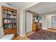 Hallway area with bookcase and access to bedroom at 151 N Orlando Ave # 212, Winter Park, FL 32789