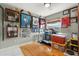 Unique bedroom decor with hockey memorabilia, natural light, and hardwood floors at 151 N Orlando Ave # 212, Winter Park, FL 32789