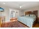 Bedroom with hardwood floors and a view of the bathroom at 151 N Orlando Ave # 212, Winter Park, FL 32789