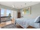 Bright bedroom with hardwood floors and water view at 151 N Orlando Ave # 212, Winter Park, FL 32789