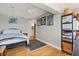 Bedroom featuring hardwood floors and a decorative metal frame bed at 151 N Orlando Ave # 212, Winter Park, FL 32789