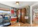 Unique bedroom decor with hockey memorabilia, natural light, and hardwood floors at 151 N Orlando Ave # 212, Winter Park, FL 32789