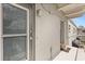 Exterior view of a unit showcasing a doorway with screen door and concrete exterior at 151 N Orlando Ave # 212, Winter Park, FL 32789