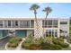 Exterior of property featuring two-story architecture and lush landscaping at 151 N Orlando Ave # 212, Winter Park, FL 32789
