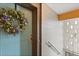 Inviting front door adorned with a decorative wreath, adding a touch of charm at 151 N Orlando Ave # 212, Winter Park, FL 32789