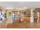 Open kitchen design featuring light wood cabinetry, stainless appliances, and an island with seating at 151 N Orlando Ave # 212, Winter Park, FL 32789