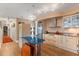 Contemporary kitchen with stainless steel appliances, granite counters, and modern lighting fixtures at 151 N Orlando Ave # 212, Winter Park, FL 32789