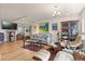 Cozy living room with hardwood floors, recessed lighting, and eclectic decor at 151 N Orlando Ave # 212, Winter Park, FL 32789