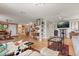Open living space features hardwood floors, a comfortable seating arrangement, and contemporary lighting at 151 N Orlando Ave # 212, Winter Park, FL 32789