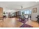 Open-concept living area featuring water views, hardwood floors, and a dining area at 151 N Orlando Ave # 212, Winter Park, FL 32789