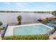 Community in-ground pool overlooking the lake, offering a refreshing escape at 151 N Orlando Ave # 212, Winter Park, FL 32789