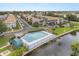 Community view of an in-ground pool with lake access, perfect for relaxing and recreation at 151 N Orlando Ave # 212, Winter Park, FL 32789