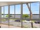 Large window showing the view of the lake and parked cars at 151 N Orlando Ave # 212, Winter Park, FL 32789