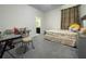 This bedroom features gray carpet and a desk for studying at 16611 Toccoa Row, Winter Garden, FL 34787