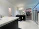 The main bathroom features double sinks, a glass shower, and a spacious walk-in closet at 16611 Toccoa Row, Winter Garden, FL 34787