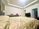 Comfortable main bedroom with a tray ceiling, neutral decor, and a TV for cozy nights in at 16611 Toccoa Row, Winter Garden, FL 34787