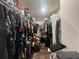 Large walk-in closet with extensive storage solutions, providing ample space for clothes and accessories at 16611 Toccoa Row, Winter Garden, FL 34787