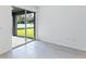 Bright living room with tile floors, sliding glass doors to patio and backyard views at 176 Duckweed Ave, Fruitland Park, FL 34731