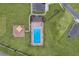 Top-down aerial view of a community pool and playground surrounded by grass and neighborhood homes at 189 Luxmore Rd, Groveland, FL 34736