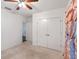 Carpeted bedroom featuring double closets, light walls and ceiling fan with lighting at 189 Luxmore Rd, Groveland, FL 34736