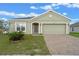 Lovely single-story home with brick driveway, manicured lawn and cozy front entrance for curb appeal at 189 Luxmore Rd, Groveland, FL 34736