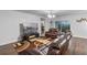 Inviting living room featuring leather sofas, a modern media center and sliding glass doors for natural light at 189 Luxmore Rd, Groveland, FL 34736