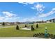 Green picnic area with covered seating, trees, and manicured landscaping in a community setting at 189 Luxmore Rd, Groveland, FL 34736
