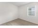 Cozy bedroom with carpet and a window with blinds at 192 Duckweed Ave, Fruitland Park, FL 34731