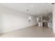 Bright and airy living room with tile flooring and an open layout to the kitchen at 192 Duckweed Ave, Fruitland Park, FL 34731