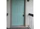 Close-up of a stylish front door with a fresh coat of paint and modern hardware at 2002 Cascades Blvd # 201, Kissimmee, FL 34741