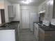 Kitchen area featuring stainless steel appliances, ample counter space, and updated cabinets at 2002 Cascades Blvd # 201, Kissimmee, FL 34741
