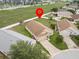 Aerial shot of home with a large yard, shed, and well-maintained lawn in a quiet neighborhood at 204 Cotswold Cir, Davenport, FL 33837