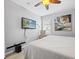 Comfortable bedroom with a ceiling fan, TV, and soft natural light at 204 Cotswold Cir, Davenport, FL 33837