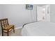 Bedroom featuring a comfortable bed, simple furnishings, and a mounted TV for relaxation at 204 Cotswold Cir, Davenport, FL 33837