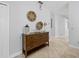 Welcoming hallway featuring a stylish console table and decorative wall art, leading to other areas of the home at 204 Cotswold Cir, Davenport, FL 33837