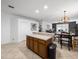 Spacious kitchen with a breakfast bar, ample counter space, and an open view to the dining area at 204 Cotswold Cir, Davenport, FL 33837