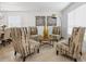 Inviting living room featuring patterned chairs, creating a cozy and stylish gathering space at 204 Cotswold Cir, Davenport, FL 33837