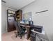 Functional home office offers built-in shelving, large desk, and a comfortable workspace at 204 Cotswold Cir, Davenport, FL 33837