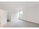 Neutral bedroom with gray carpet, a window, and a closet at 2261 Sirena Ln, Mount Dora, FL 32757
