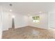 Spacious bedroom with tiled floors, recessed lighting, and a large window overlooking the yard at 2261 Sirena Ln, Mount Dora, FL 32757