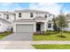 Charming two-story home with a well-manicured lawn and a two car garage at 2261 Sirena Ln, Mount Dora, FL 32757