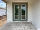 Exterior image of a back porch and double doors with olive green trim at 2379 Broadbrook Drive, St Cloud, FL 34771