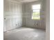 Unfinished bedroom showcasing a bright window and spacious layout at 2379 Broadbrook Drive, St Cloud, FL 34771