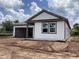 New home featuring an attached garage and gray vinyl siding at 2379 Broadbrook Drive, St Cloud, FL 34771