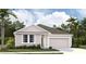 Charming single-story home featuring a well-manicured lawn and attached garage at 2379 Broadbrook Drive, St Cloud, FL 34771