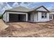 New home featuring an attached garage and gray vinyl siding at 2379 Broadbrook Drive, St Cloud, FL 34771